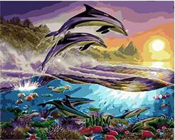 Whale jumping out of the sea under sunset